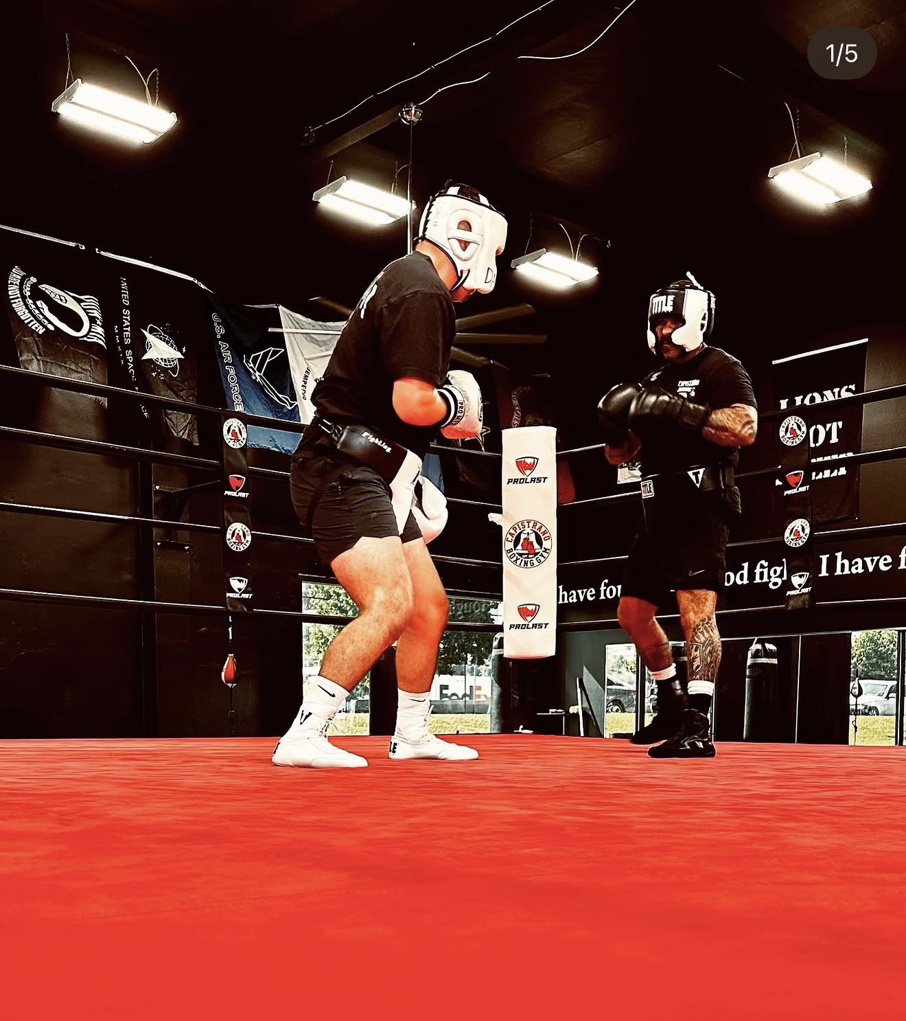 Boxers sparring in the ring at Capistrano Boxing Gym